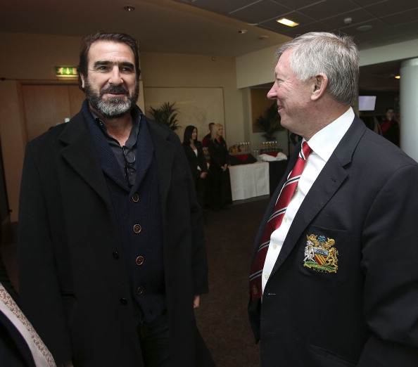 Eric Cantona talks with Sir Alex Ferguson after the unveiling of a statue of Manager Sir Alex Ferguson of Manchester United at Old Trafford on November 23, 2012 in Manchester, England