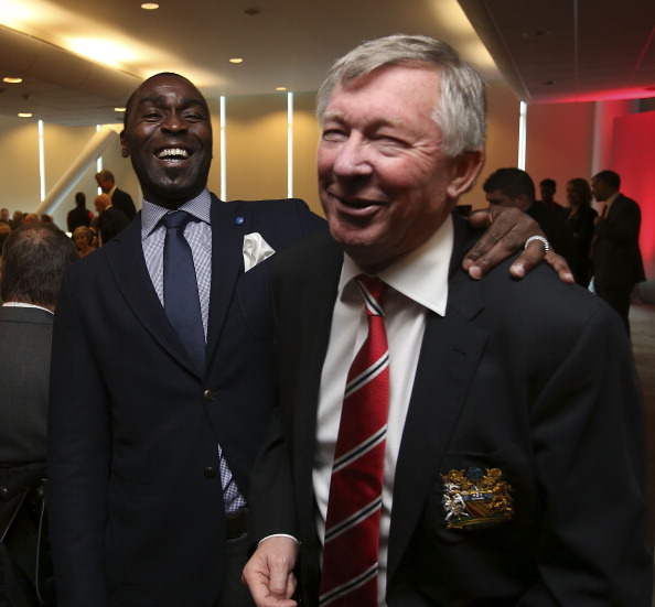 Andy Cole talks with Sir Alex Ferguson after the unveiling of a statue of Manager Sir Alex Ferguson of Manchester United at Old Trafford on November 23, 2012 in Manchester, England