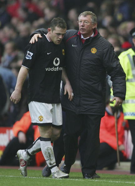 Wayne Rooney of Manchester United is congratulated by manager Alex Ferguson after his goal gave Manchester United victory over Liverpool  2005