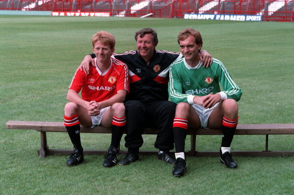 August 1988, Manchester United Manager Alex Ferguson (centre) poses for a photograph with his players Gordon Strachan (left) and goalkeeper Jim Leighton