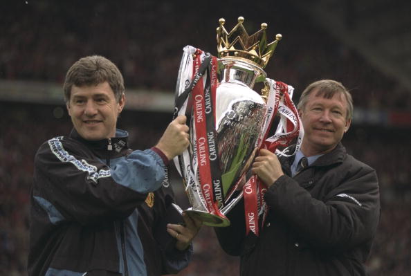 Alex Ferguson, the Manchester United manager, and Brian Kidd, the assistant manager, hold aloft the FA Carling Premier League Championship Trophy  1997