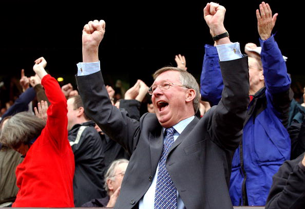 Sir Alex Ferguson celebrates David Beckham's opening goal during the FA Barclaycard Premiership match between Manchester United v Charlton Athletic at Old Trafford on May 3, 2003