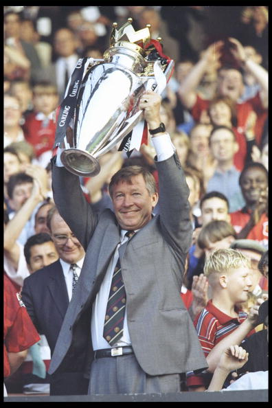 Alex Ferguson of Manchester United holds aloft the Premier league trophy before the start of the pre-season friendly between Manchester United and Inter Milan 1996