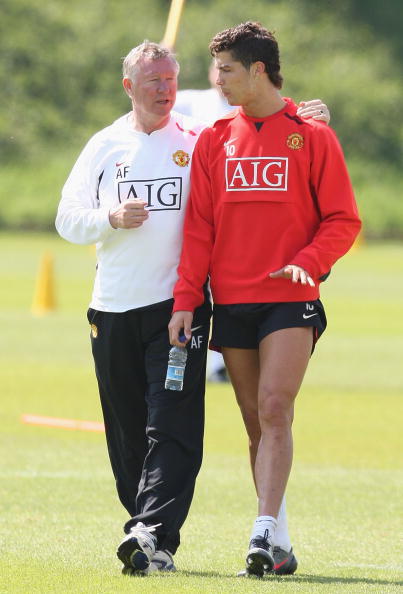 Cristiano Ronaldo of Manchester United talks with SIr Alex Ferguson during a First Team Training Session at Carrington Training Ground on May 15 2008 in Manchester, England