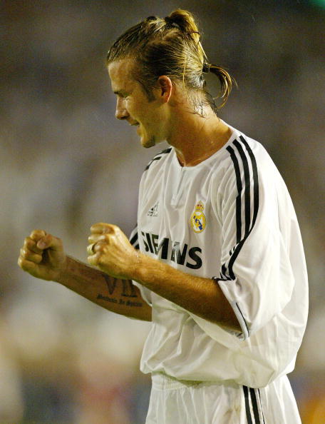 Real Madrid's David Beckham reacts when he scores his first goal after joining during the first half pre-season match agaisnst FC Tokyo at the National Stadium in Tokyo 05 August 2003