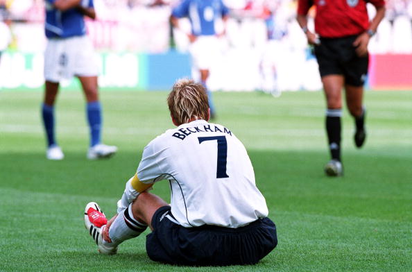 2002 FIFA World Cup Finals. Quarter Finals. Shizuoka, Japan. 21st June 2002. England 1 v Brazil 2. England captain David Beckham sits on the pitch after picking up an injury