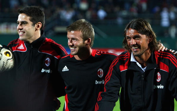 David Beckham (C) of AC Milan, celebrates with Kaka (L) and Paolo Maldini (R) after the Dubai Football Challenge match between AC Milan and Hamburger SV