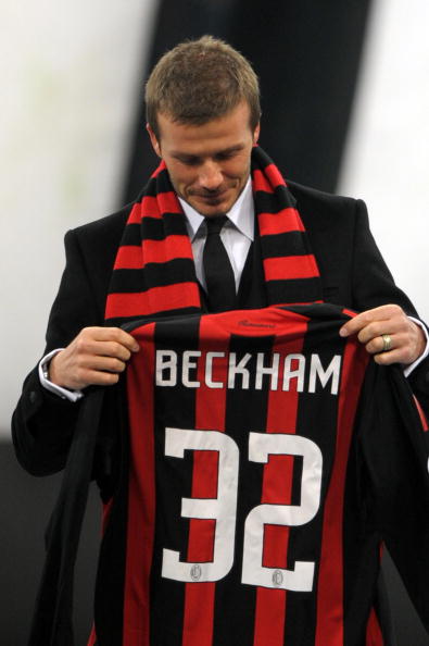 New AC Milan's midfielder David Beckham, holding his number 32 AC Milan's jersey, is presented to supporters prior the team's Italian Serie A match against Udinese December 21, 2008