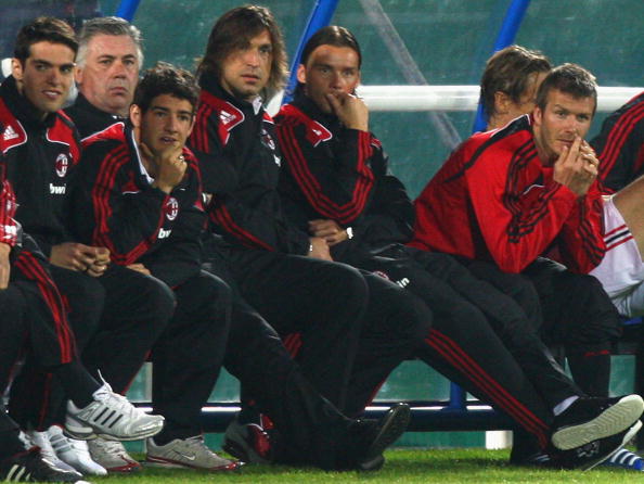 David Beckham (R) of AC Milan watches the penalty shootout form the bench after the Dubai Football Challenge match between AC Milan and Hamburger SV at The Emirates Sevens Stadium