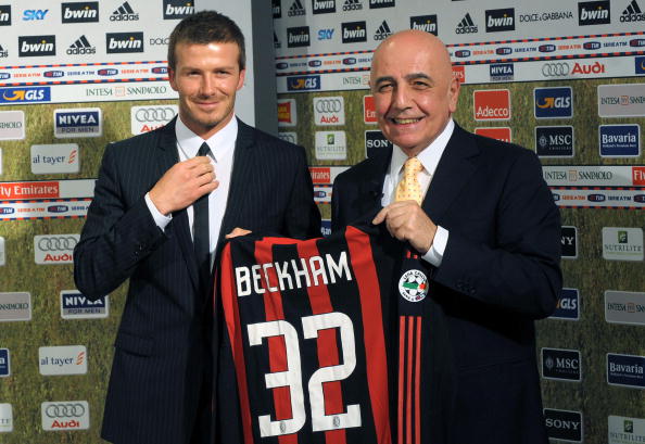 December 20, 2008 shows British footballer David Beckham (L) holding an AC Milan jersey at an official presentation with club president Adriano Galliani at the San Siro stadium in Milan
