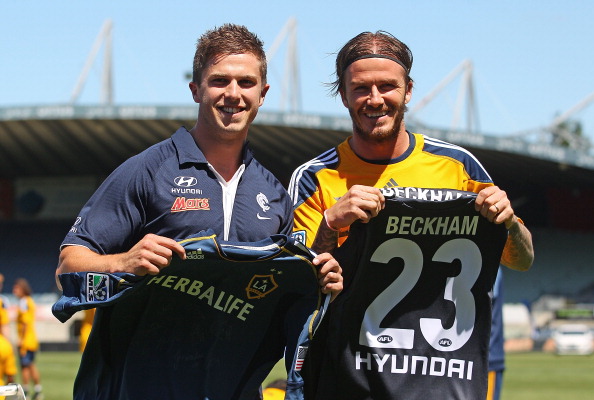 David Beckham of Galaxy exchanges jumpers & AFL team Carlton’s 2011 Best & Fairest winner, Marc Murphy during LA Galaxy training at Visy Park December 5, 2011 in Melbourne, Australia