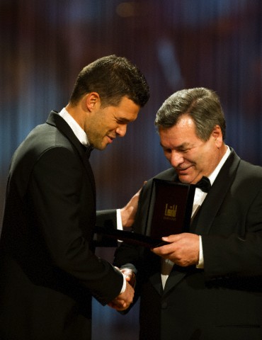 Former German soccer pro Michael Ballack (L), receives the St. Georges medal from Waldemar Hartmann in the category sports during the 8th Semper Opera Ball 2013 in Dredsen, 1 February 2013