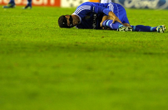 Leverkusen's Michael Ballack lies on the pitch during Champions League group E match between FC Valencia and Bayer Leverkusen at Estadi de Mestalla Stadium in Valencia, Spain, 01 November 2011.
