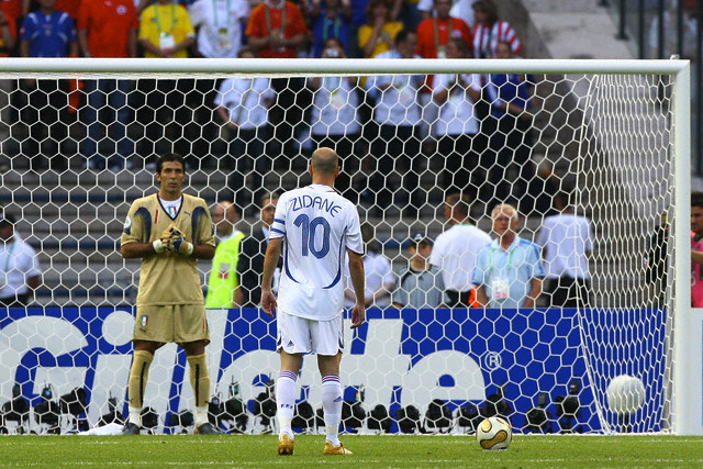 Zinedine Zidane (FRA, R) gets ready to take his penalty kick and Gianluigi Buffon (ITA) tries to disrupt his attention during the final of the 2006 FIFA World Cup between Italy and France.