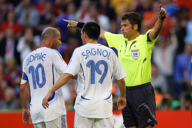 Zinedine Zidane, Willy Sagnol (FRA) and Roberto Rosetti (Referee) during the 2nd round match of the 2006 FIFA World Cup between France and Spain in Hanover, Germany. France won 3-1