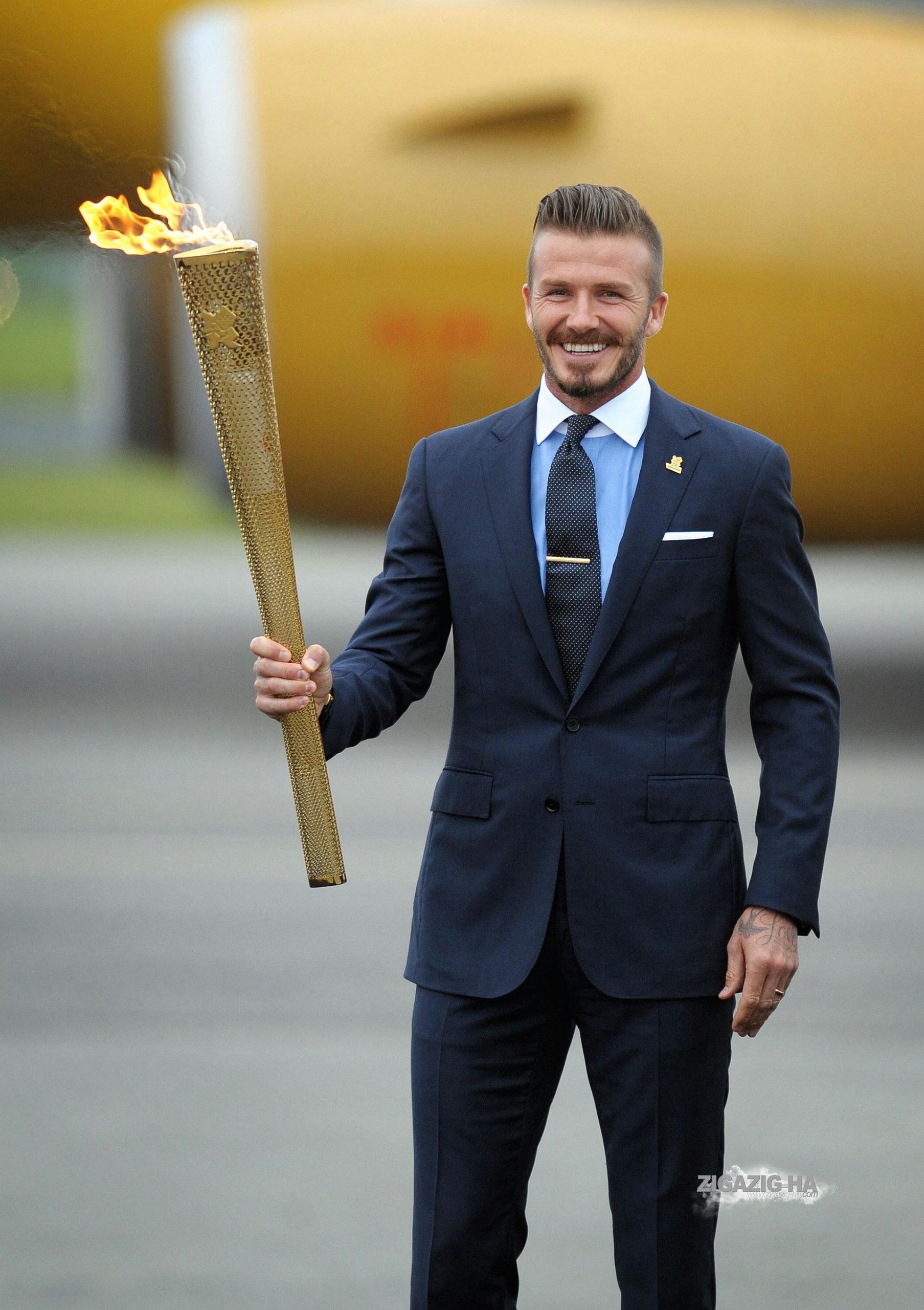 David Beckham With The London 2012 Olympic Games Flame At Royal Naval Air Station