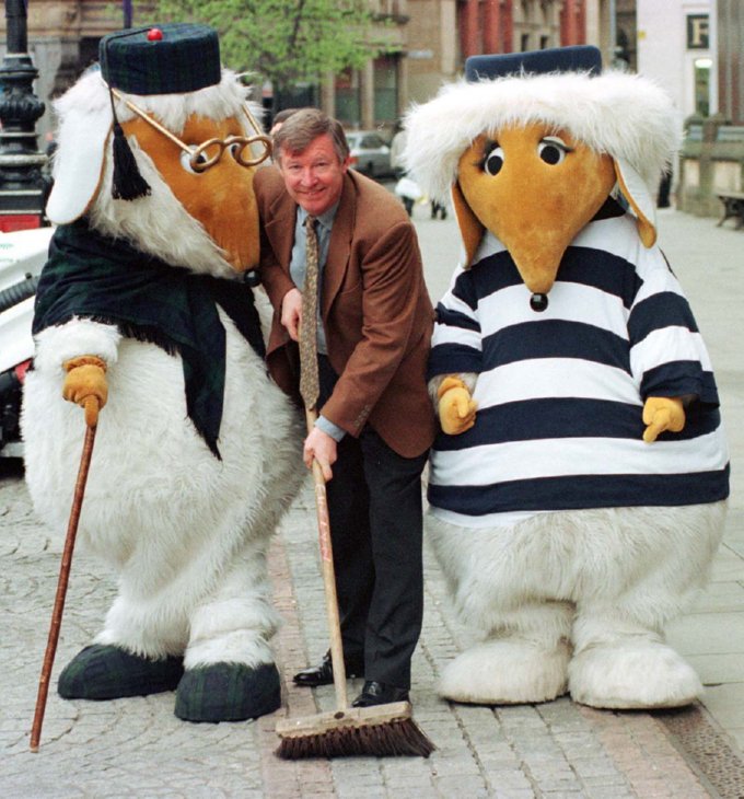 Ferguson cleans up the streets of Manchester with a couple of old friends from his Wimbledon Common days, April 1997