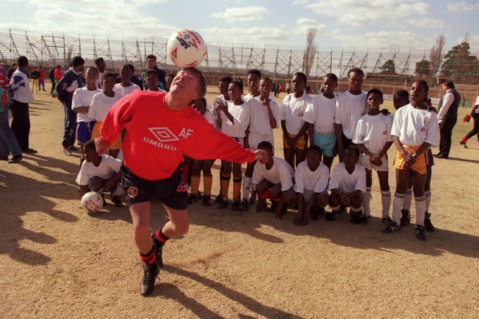Ferguson shows a group of South African children a thing or two while coaching in Soweto, July 1993