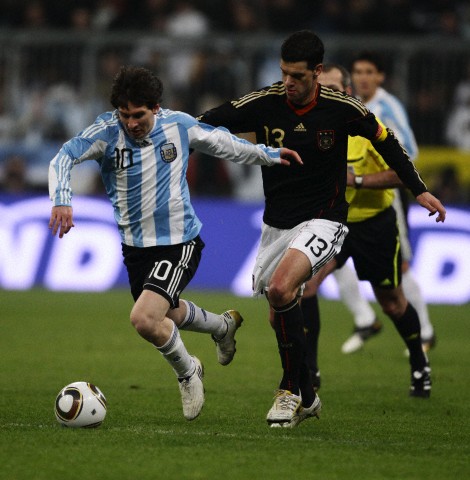 Michael Ballack (right) of Germant with Lionel Messi 2010