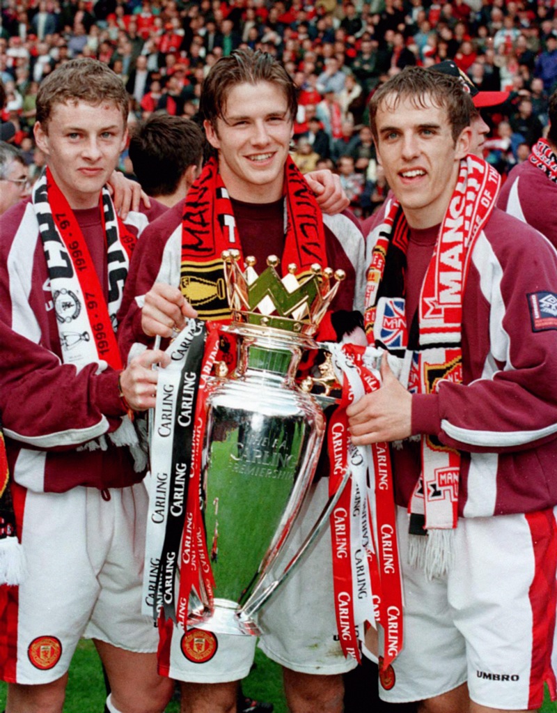 Ole Gunnar Solskjaer (left), David Beckham (centre) and Phillip Neville celebrate with the Prem trophy in May 1997