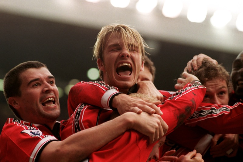 With United team-mates, and rather enjoying Ole-Gunnar Solskjaer's goal against Liverpool, in the FA Cup, January 1999