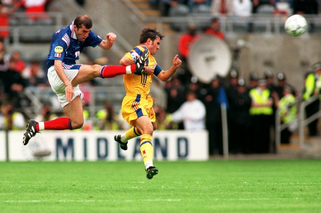 Zidane smashes the ball away from Romania’s Georghe Hagi at his first major international tournament, Euro 96