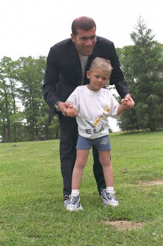 Zinedine Zidane with 5-year-old Yan who suffers from leukodystrophy, a disease which prevents him from using his legs. 2000