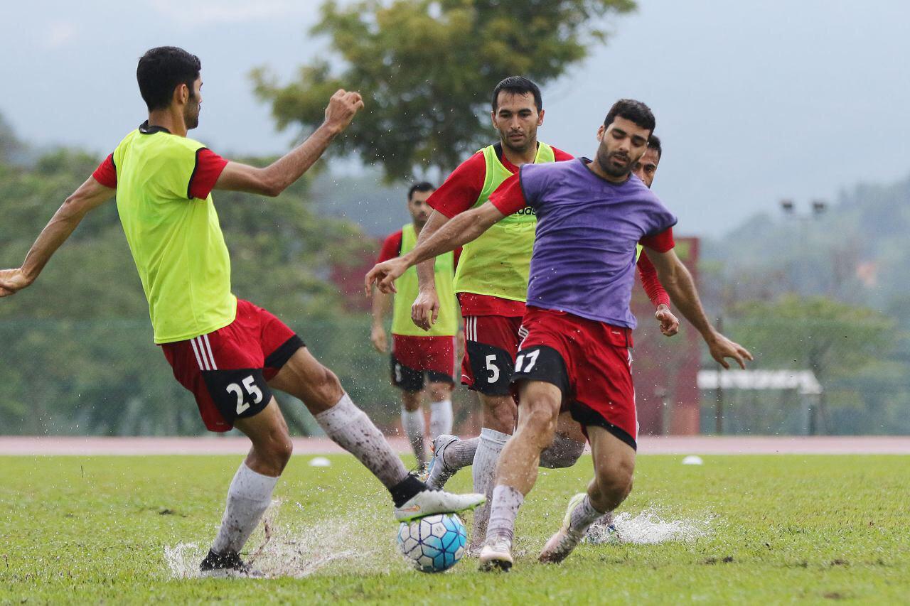 تصاویری از تمرین تیم ملی پس از  بارش سيل آسيای باران در مالزی